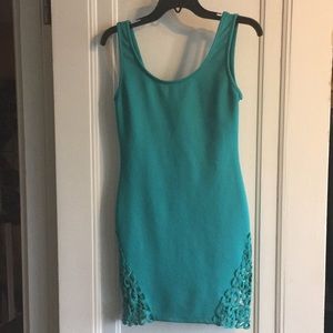Turquoise mini dress with cutout hem detail